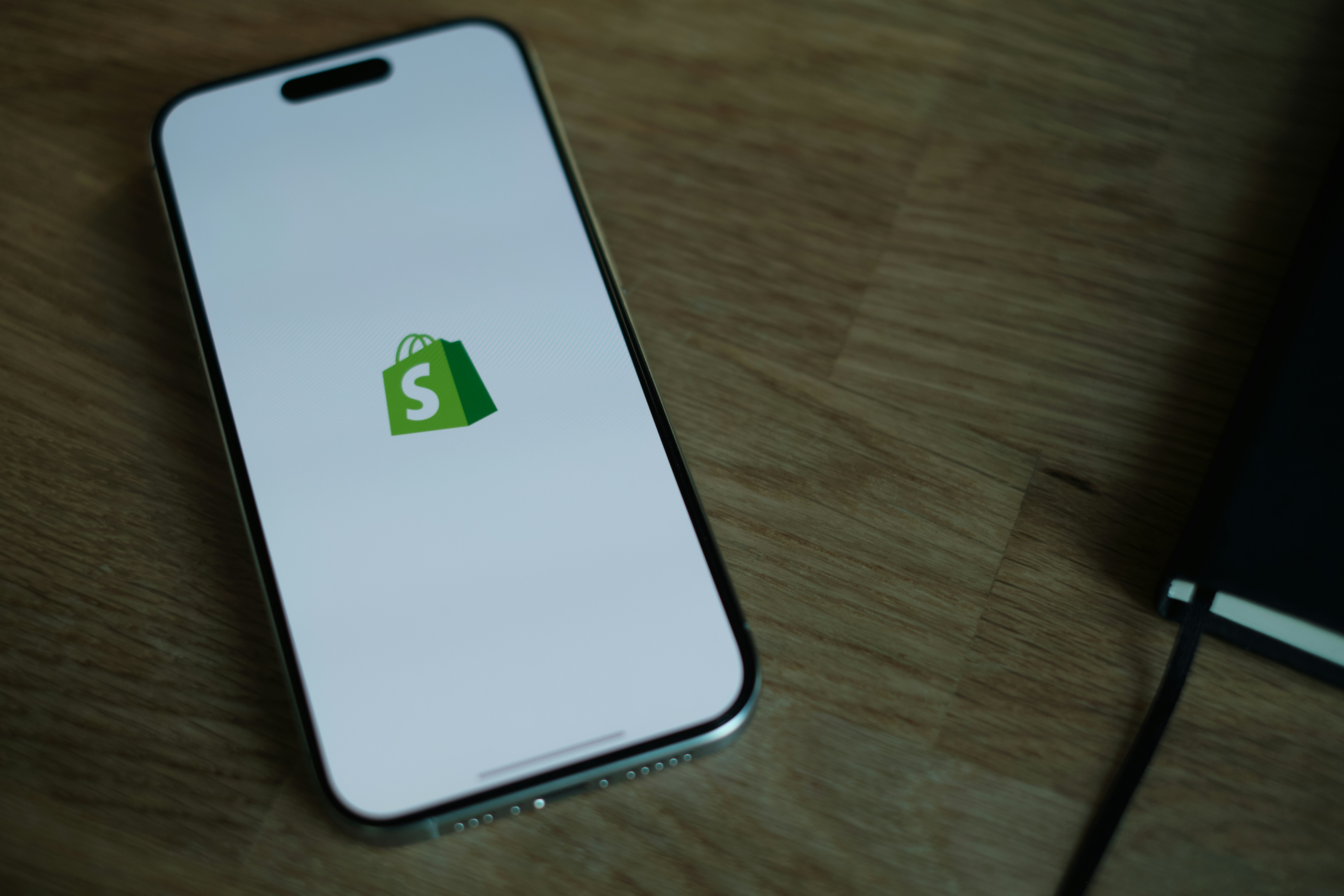 A customer's phone showing a one-click Shopify reorder link, ready to check out in a single tap.